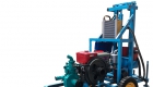 machines drilling a water well